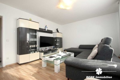 BERK Immobilien - Vermietete 3-Zimmer-Wohnung mit Stellplatz und Gartenanteil in zentraler Ortslage
