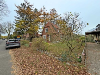 Stockelsdorf - renovierungsbedürftiges Siedlungshäuschen mit Teilkeller, Carport und großem Garten s