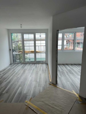 Zentrale Neubauwohnung mit großzügigem Balkon und innovativer Energielösung in Groß-Gerau
