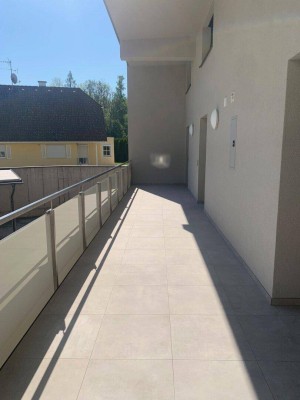 Erstbezug - Maisonettewohnung mit Reihenhauscharakter mit überdachter Terrasse und Garage