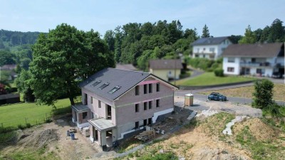 MANNELLA *Modernes Wohnen mit Einliegerwohnung und herrlicher Aussicht* – Bezugsfertig 2025!