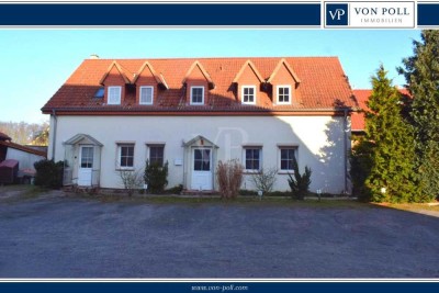 Charmantes Zweifamilienhaus mit großzügigem Wohnraum und Garten