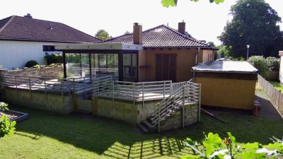 Direkt einziehen und wohlfühlen! Modernisierter Bungalow mit beheiztem Wintergarten und Vollkeller