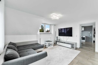 Moderne Dachgeschosswohnung mit großem Hobbyraum und Garage!