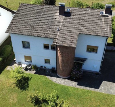 Naturnah und vielseitig: Einfamilienhaus mit Gartenparadies und großem Potenzial am Feldrand