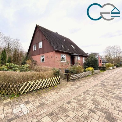 Gemütliches Einfamilienhaus in ansprechender Wohnlage mit großem Garten, Teich und Garage!