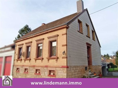 Spiesen - Einfamilienhaus mit großem Grundstück in zentraler Lage