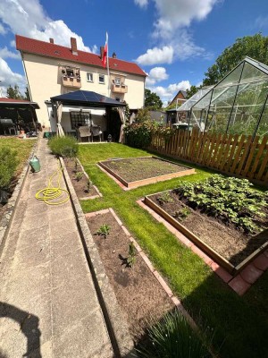 3-Zimmer Wohnung mit eigenem Garten, Garage und Einbauküche