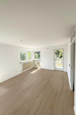 Erstbezug: 2-Zimmer Wohnung mit neuer Einbauküche, Westbalkon & Tiefgaragen Stellplatz