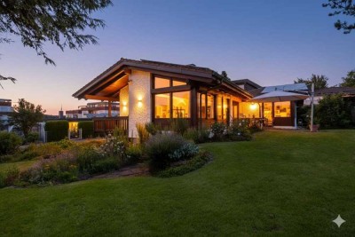 Exklusives Wohnen am Wächtersberg – Stilvoller Bungalow mit ELW & sofort bebaubarem Grundstück