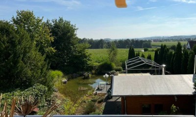 Helle Erdgeschosswohnung mit Terrasse und Wintergarten