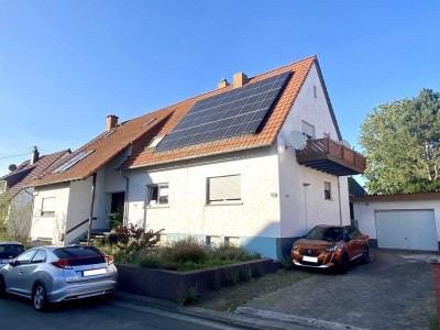 Großzügiges Einfamilienhaus mit Garage und idyllischem Garten - ideal für größere Familien