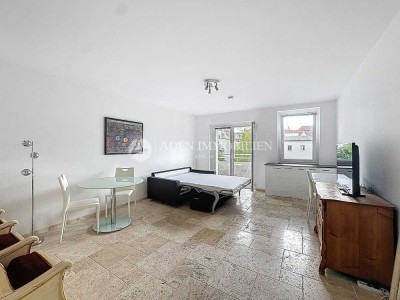 Stilvolles Einzimmerapartment mit Natursteinboden und Balkon – möbliert, mitten in Wilmersdorf