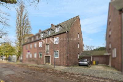 Zeitloses Dreifamilienhaus mit gepflegter Substanz und geschütztem Garten hinter dem Haus