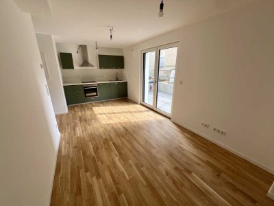 Erstbezug: Moderne 2-Zimmer-Neubauwohnung mit Terrasse und seitlichem Rheintalblick