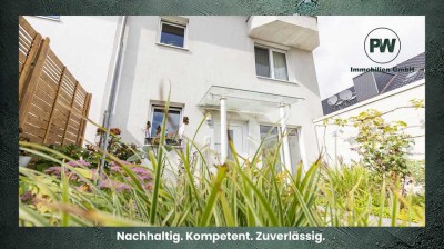 Wohnen wie im Haus: Großzügige Gartenwohnung mit Souterrain, Kamin & Garage