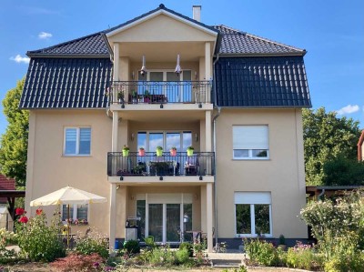 3,5 Zi Wohnung mit großer Südterasse und Gartenanteil in Niedrigenergiehaus