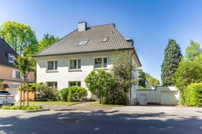 Ein Dreifamilienhaus mit großem Garten - mitten in der Stadt