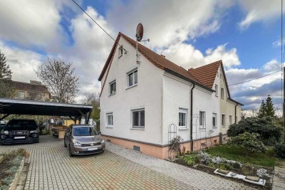 Raum für Ihre Ideen: Vorteilhaft geschnittene DHH mit Garten, Anbau, Doppelcarport und Potenzial