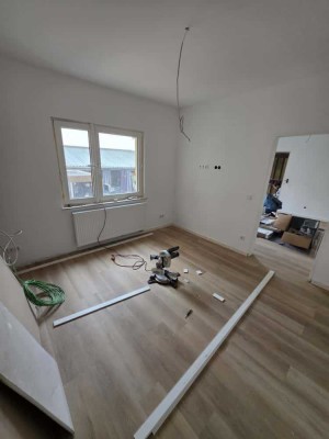 Erstbezug nach Kernsanierung – moderne 1-Zimmer-Wohnung mit Gartenmitnutzung & Pool