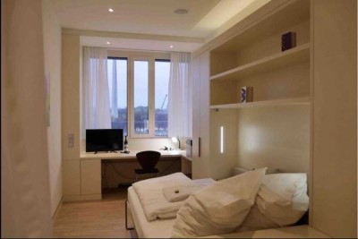 Stilvolles Miniapartment mit Concierge-Service und Fitnessbereich im Herzen der Stadt