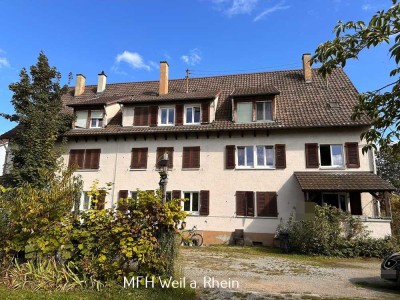 Grenznahes Mehrfamilienhaus mit 9 Wohneinheiten, großem Garten und viel Potential