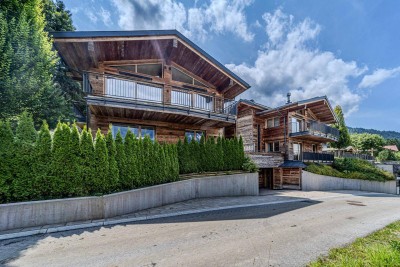 Edle Chalets in „Ski-in &amp; Ski-out“-Lage mit imposanten Kaiserblick