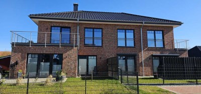 Brunsbüttel-Zentrum: Sonnige, große Neubauwohnung mit Garten zu vermieten!