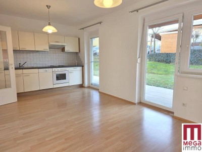 Sonnige Erdgeschoss-Wohnung mit Terrasse und Gartenanteil