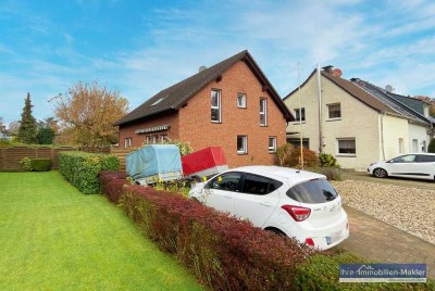 Stilvolles Wohnen auf zwei Ebenen mit eigenem Garten.