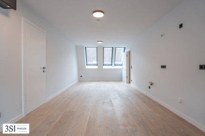 Urbaner Wohnkomfort mit Charme und Grünblick – stilvolle 3-Zimmer-Wohnung mit Balkon in ruhiger Innenhoflage