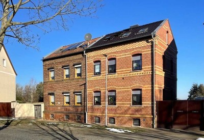 Familienfreundliche Doppelhaushälfte in Raguhn mit großzügigem Garten und idyllischem Teich