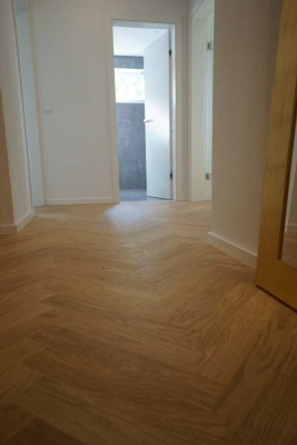 Grüne Oase: Hochwertig sanierte 3 Zimmer Wohnung mit Gartenzugang