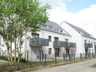 Moderne Dreizimmerwohnung mit Terrasse und Garten