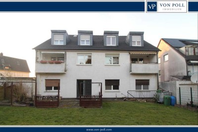 Wohn- und Geschäftshaus mit großem Garten und Garagen