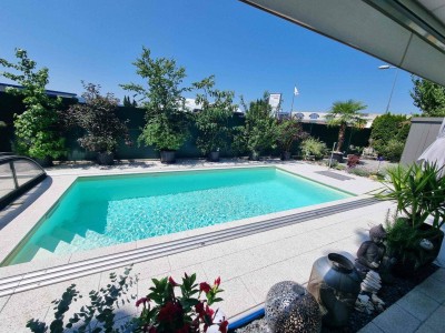 Traumhafte und neuwertige 3 Zi Gartenwohnung mit 220m² Eigengarten und Massiv-Pool in Waidmannsdorf mit Tiefgarage