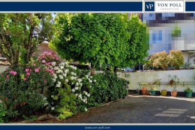 VON POLL - OBERURSEL: Diskretes  Zweifamilienhaus mit idyllischem Innenhof