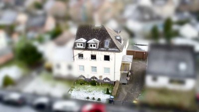 Attraktive Kapitalanlage - Mehrfamilienhaus mit 4 Wohnungen und Garagen