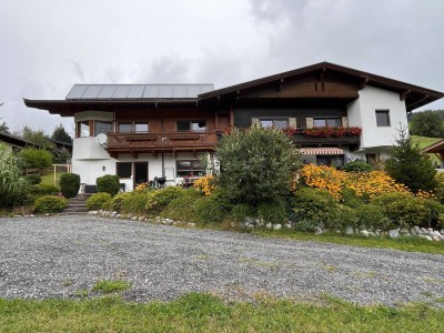 Sonnige Terrassenwohnung mit Gartenanteil