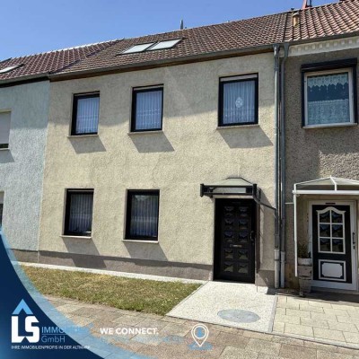Charmantes Reihenmittelhaus mit modernisiertem Dachgeschoss, liebevoll gestaltetem Garten