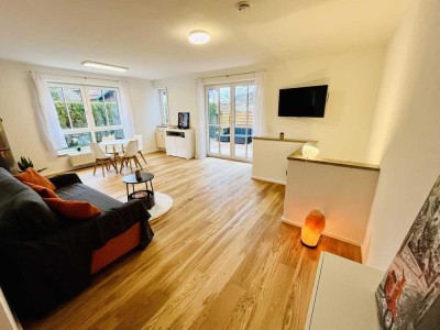 2 Zimmer + Hobbyraum: Gartenwohnung mit 105 qm Wohn-Nutzfläche & Sauna