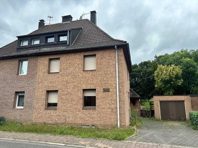 Renovierungsbedürftige Doppelhaushälfte mit Garage in Marl-Brassert