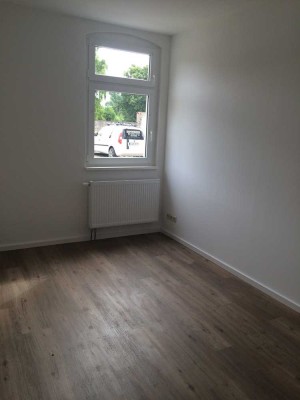 Erdgeschosswohnung mit Terrasse