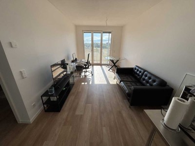 Exklusive 2-Zi.-Neubauwohnung mit Balkon, EBK & TG-Stellplatz – ideal für 1–2 Personen