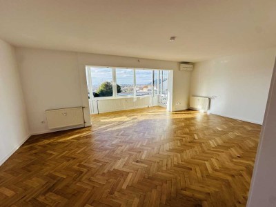 Exklusive 4-Zimmer-Wohnung mit Garten, Terrasse, und Panoramablick im begehrten Musikerviertel