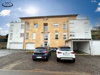 Vermietete Dreizimmerwohnung im 2. Obergeschoss mit Terrasse und Stellplatz