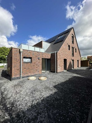 Exklusive Neubau-Erdgeschoss-Wohnung mit großem Garten, Wallbox, Lüftungsanlage u.v.m.