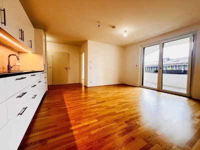 EXKLUSIVER ERSTBEZUG nahe Hauptbahnhof - Sonnige Wohnung mit großzügiger Freifläche und Küche in einem modernen Neubauprojekt