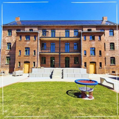 Attraktive 3-Raum-Wohnung mit großer Wohnküche, Südbalkon und eigenem Garten.