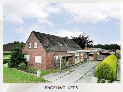 Idyllische Kanallage:  Mehrparteienhaus mit großem Grundstück